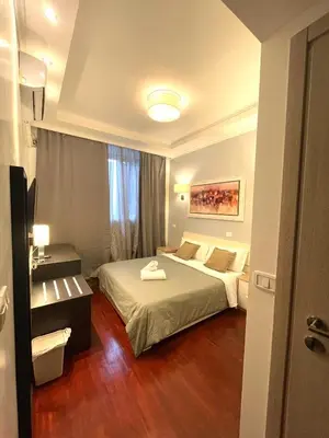 a hotel room with a bed and a window at KayDee GuestHouse in Rome