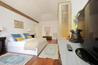 a bedroom with a bed and a tv in it at YCH-Penthouse Fiammetta a Piazza Navona in Rome