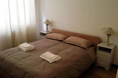 a bedroom with a bed with two towels on it at Vatican City House Roma in Rome