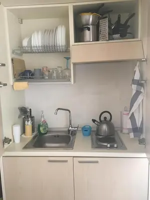a kitchen with a sink and a counter with dishes at Vatican City House Roma in Rome
