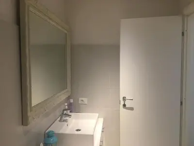 a bathroom with a sink and a mirror at Vatican City House Roma in Rome
