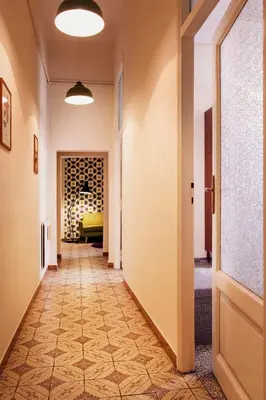 a hallway with a hallway leading into a room at TrastevereHome - Peretti Rome in Rome