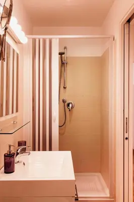 a bathroom with a sink and a shower at TrastevereHome - Paglia House of 17Century in Trastevere in Rome