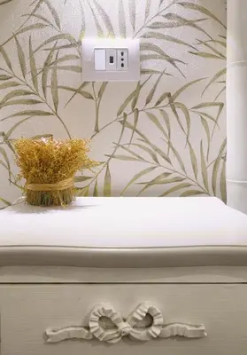 a bathroom with a flower vase and a clock at Buongiorno Colosseo in Rome