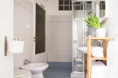 a bathroom with a toilet and a sink at TrastevereHome - Ripa Rome Trastevere Home in Rome
