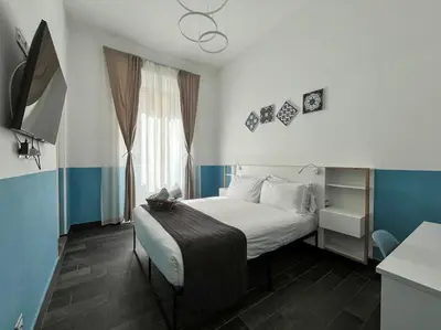 a bathroom with a shower and a toilet and a sink at Arch Rome Suites in Rome
