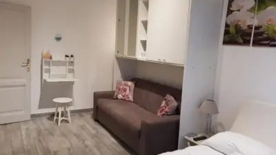 a small living room with a couch and a bed at Rome sweet home in Rome