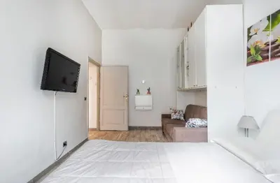 a living room with a couch and a flat screen tv at Rome sweet home in Rome
