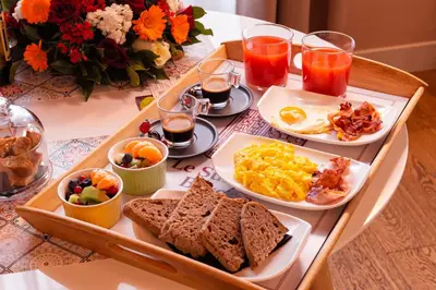 a tray of breakfast foods on a table at Le Suite del Barone in Rome