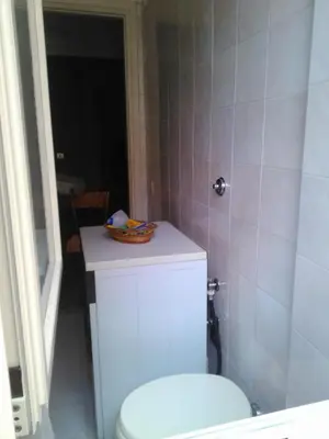 a bathroom with a toilet and a bowl on top of it at Il Vostro Comfort in Rome