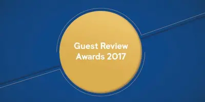 a yellow circle with a sign that reads guest review awards at Il Vostro Comfort in Rome