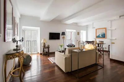 a living room with a couch and a table at The Pantheon view in the heart of Rome in Rome