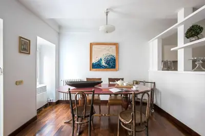 a dining room with a table and chairs at The Pantheon view in the heart of Rome in Rome