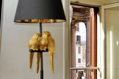 a lamp with two stuffed animals on a wall at The Pantheon view in the heart of Rome in Rome