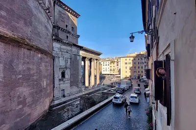 a view of a city street with cars and buildings at The Pantheon view in the heart of Rome in Rome