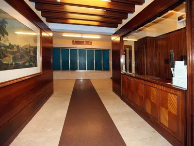 a hallway with wood paneled walls and a hallway with a hallway at Alice Home in Rome