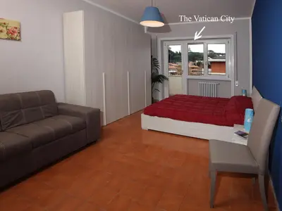 a living room with a bed and a couch at Alice Home in Rome