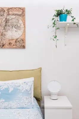 a bedroom with a bed and a map on the wall at Coronari stylish apartment in Rome