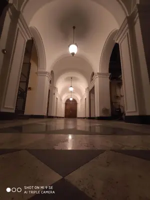 an empty hallway of a building with a light fixture at Double B Ferruccio I in Rome