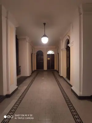 an empty hallway in a building with a light fixture at Double B Ferruccio I in Rome
