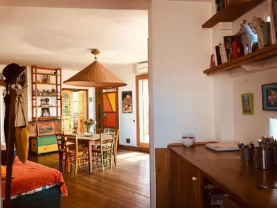 a kitchen and a living room with a dining room at San Saba Rooftop Garden in Rome
