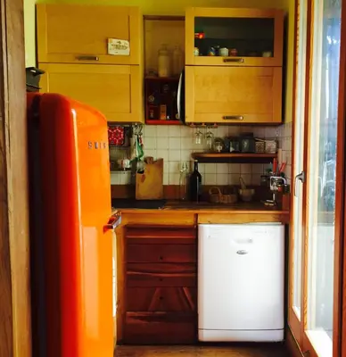 a kitchen with a white refrigerator and a counter at San Saba Rooftop Garden in Rome