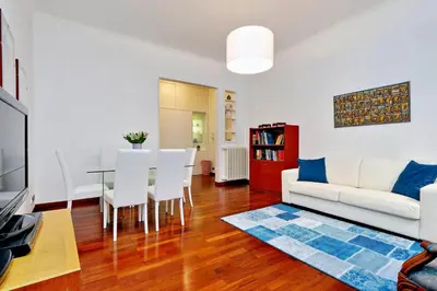 a living room with a white couch and a table at RomeAsYouLike-Monti Experience 295 in Rome