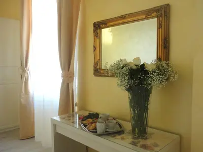 a bathroom with a wooden sink and a mirror at Cameo B&B in Rome