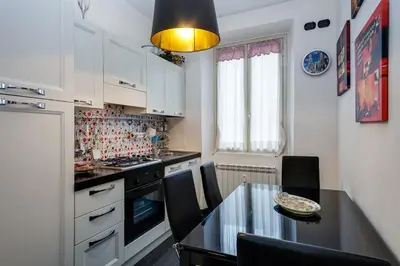 a kitchen with a glass table and a counter top at Mammamia in Rome