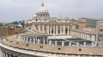 a large building with a domed building with statues in front of it at Domina Romae B&B in Rome