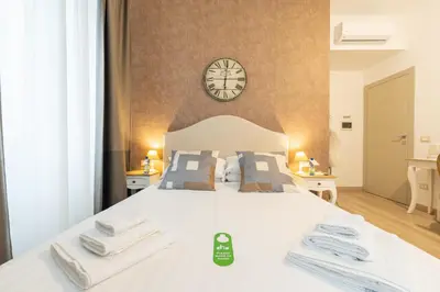 a bathroom with a toilet and a shower at Popolo Rooms&Suites in Rome