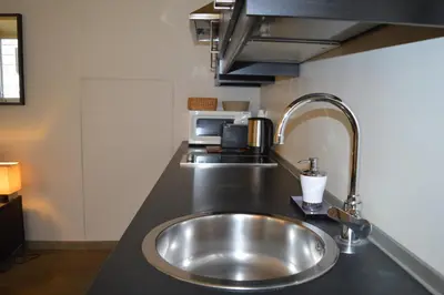 a kitchen with a stainless steel sink in a counter at Banchi Vecchi NY in Rome