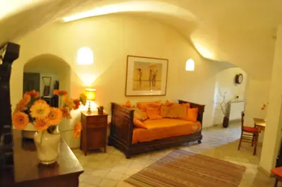 a living room with a couch and a vase of flowers at Onofrio Flat in Rome