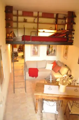 a living room with a loft bed and a couch at Onofrio Flat in Rome