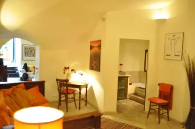a living room with a couch and a table and chairs at Onofrio Flat in Rome