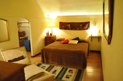 a hotel room with a bed and a couch at Onofrio Flat in Rome