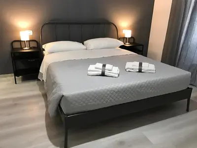 a bedroom with a bed with two towels on it at Sensation House in Rome