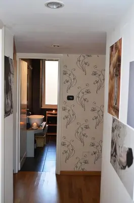 a bathroom with a wall with drawings of dolphins on it at Blue Star luxury apartment San Giovanni - Colosseo in Rome