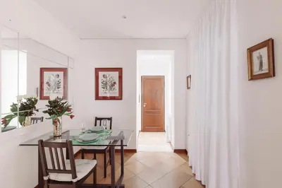 a kitchen and dining room with a table and chairs at Relais Rasella 47 in Rome