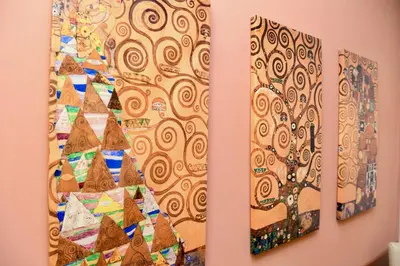 a group of three paintings hanging on a wall at Hotel Anacapri in Rome