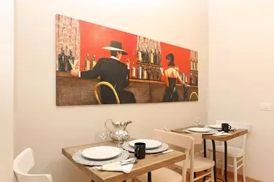 a painting of a man in a bar at Daplace - Ottavia Apartment in Rome