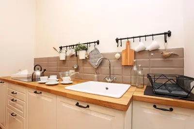 a kitchen with a sink and a counter top at Daplace - Ottavia Apartment in Rome