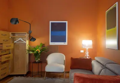 a living room with a couch and a chair at L'obelisque maison de luxe in Rome