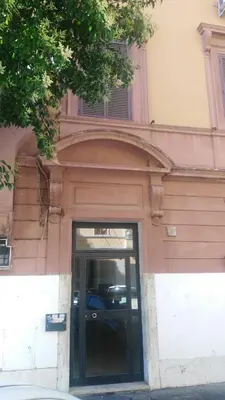 a doorway to a building with a glass door at A 2 Passi Dai Musei Luxury Guest House in Rome