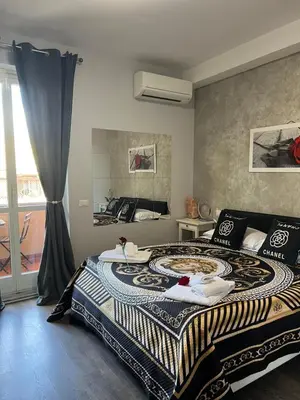 a bedroom with a large bed and a window at A 2 Passi Dai Musei Luxury Guest House in Rome