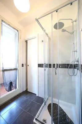 a bathroom with a shower with a glass door at A 2 Passi Dai Musei Luxury Guest House in Rome