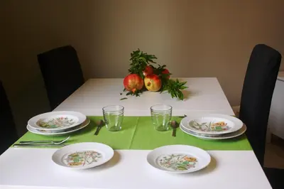 a table with plates and glasses on top of it at S Peter Nicolo' III in Rome