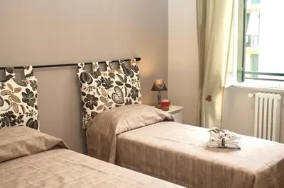 a bedroom with two beds and a window at S Peter Nicolo' III in Rome