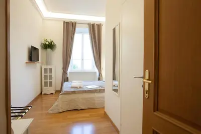 a bedroom with a bed and a window at InnsideRome in Rome
