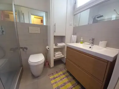 a bathroom with a toilet and a sink and a shower at Lungotevere Holidays in Rome